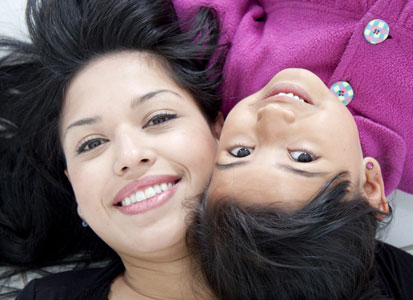 Mother and Child With Pretty Smiles